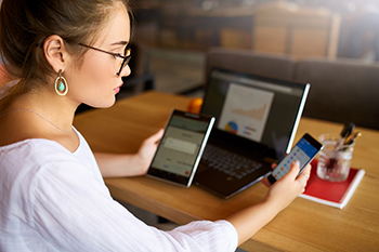 Woman looking at mobile devices.