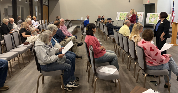 Group of people seated at Southeast Quadrant land use meeting.